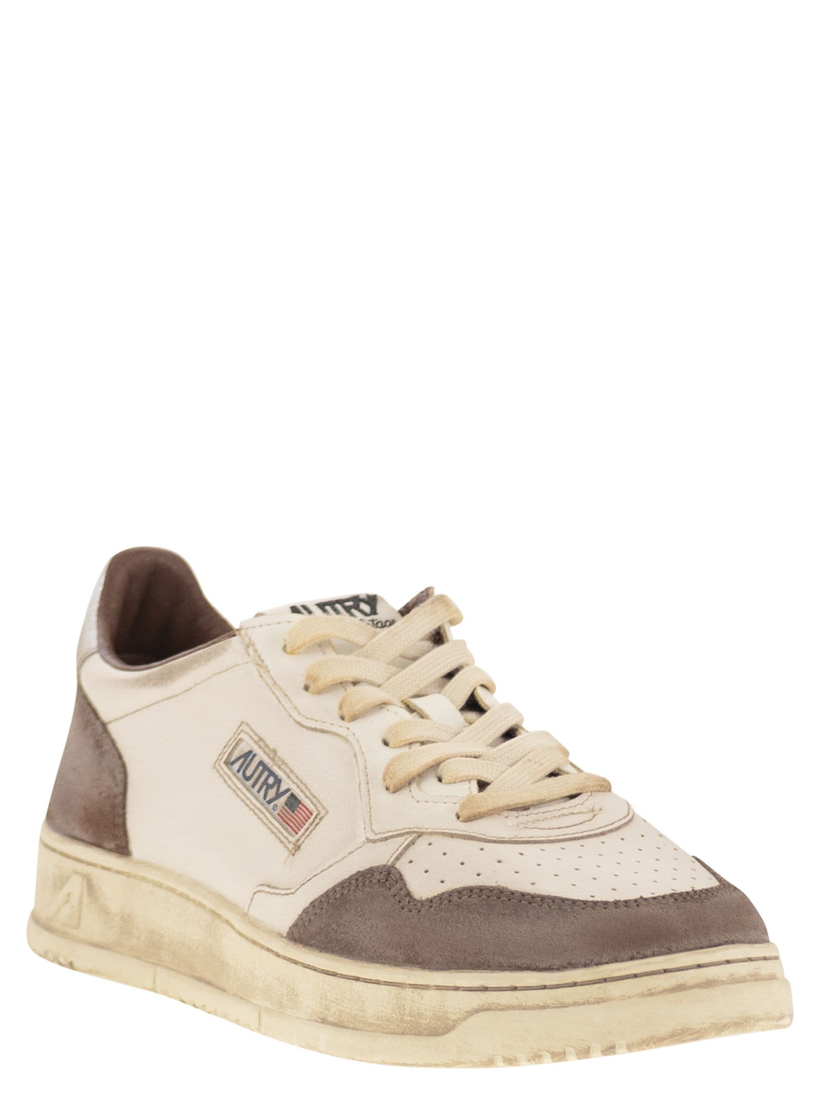 Autry Low Top Sneakers With Contrasting Leather Inserts In White