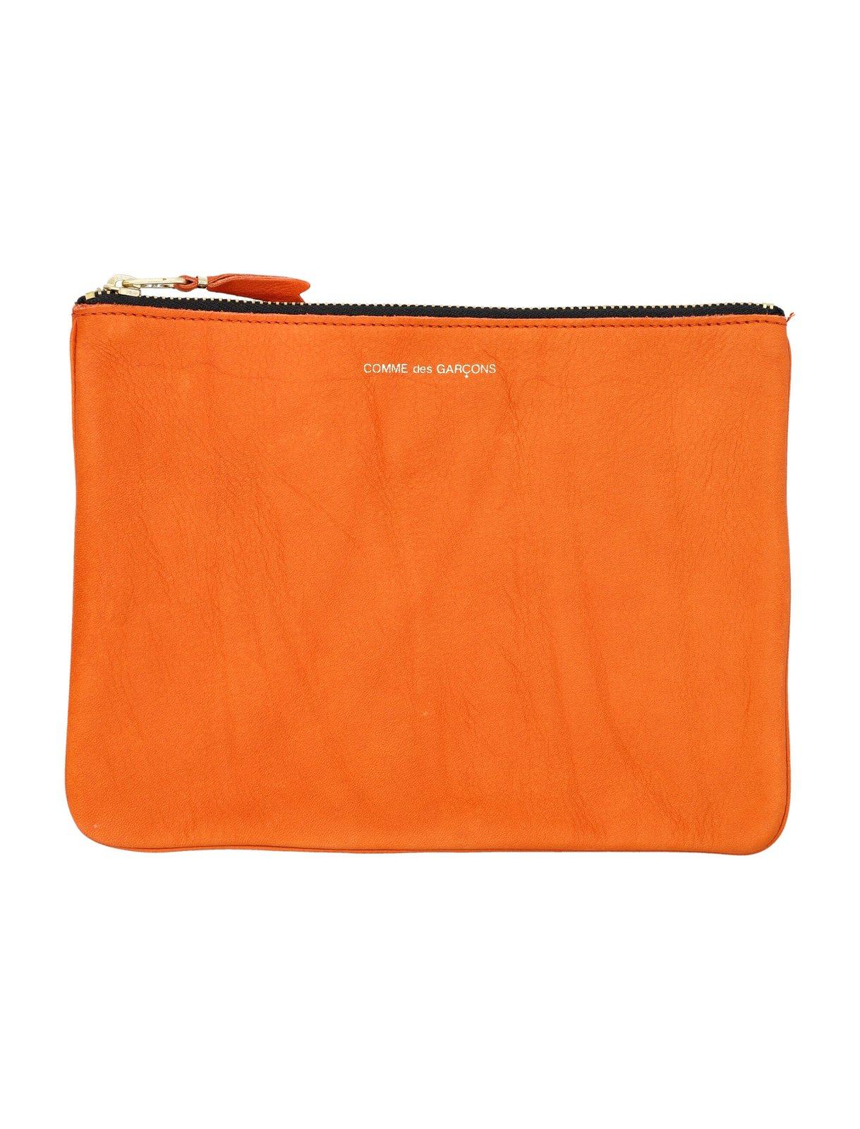 Shop Comme Des Garçons Logo Printed Zip-up Pouch In Burnt Orange