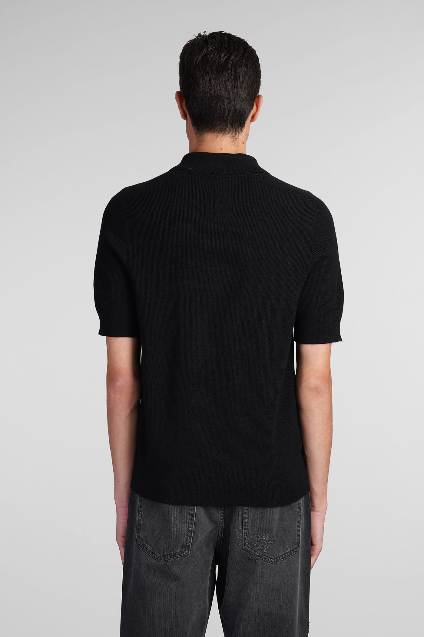 Shop Balmain Polo In Black Wool