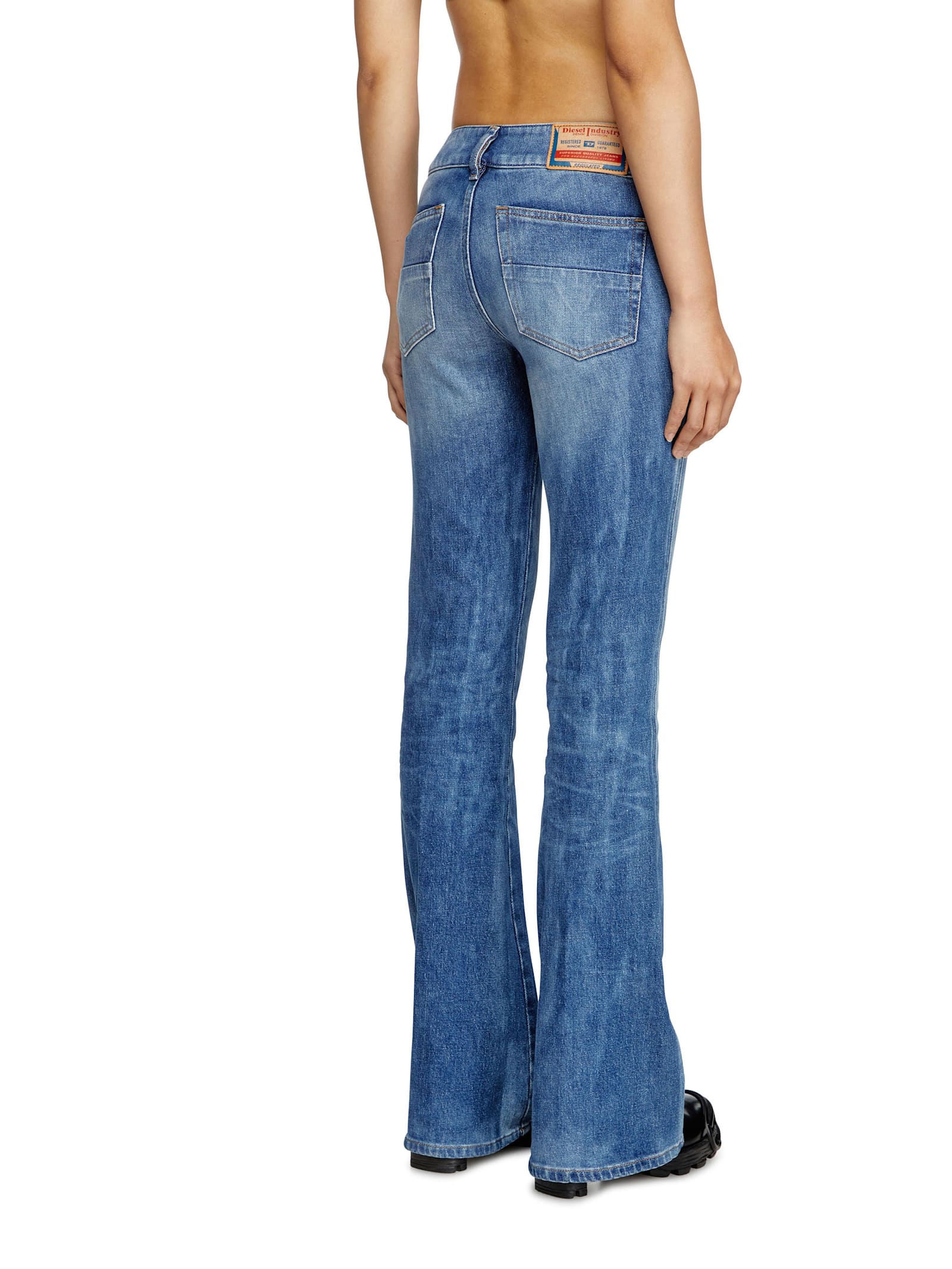 Diesel D-hush Partially Organic Cotton Flared Jeans With Back Logo Patch In Blue