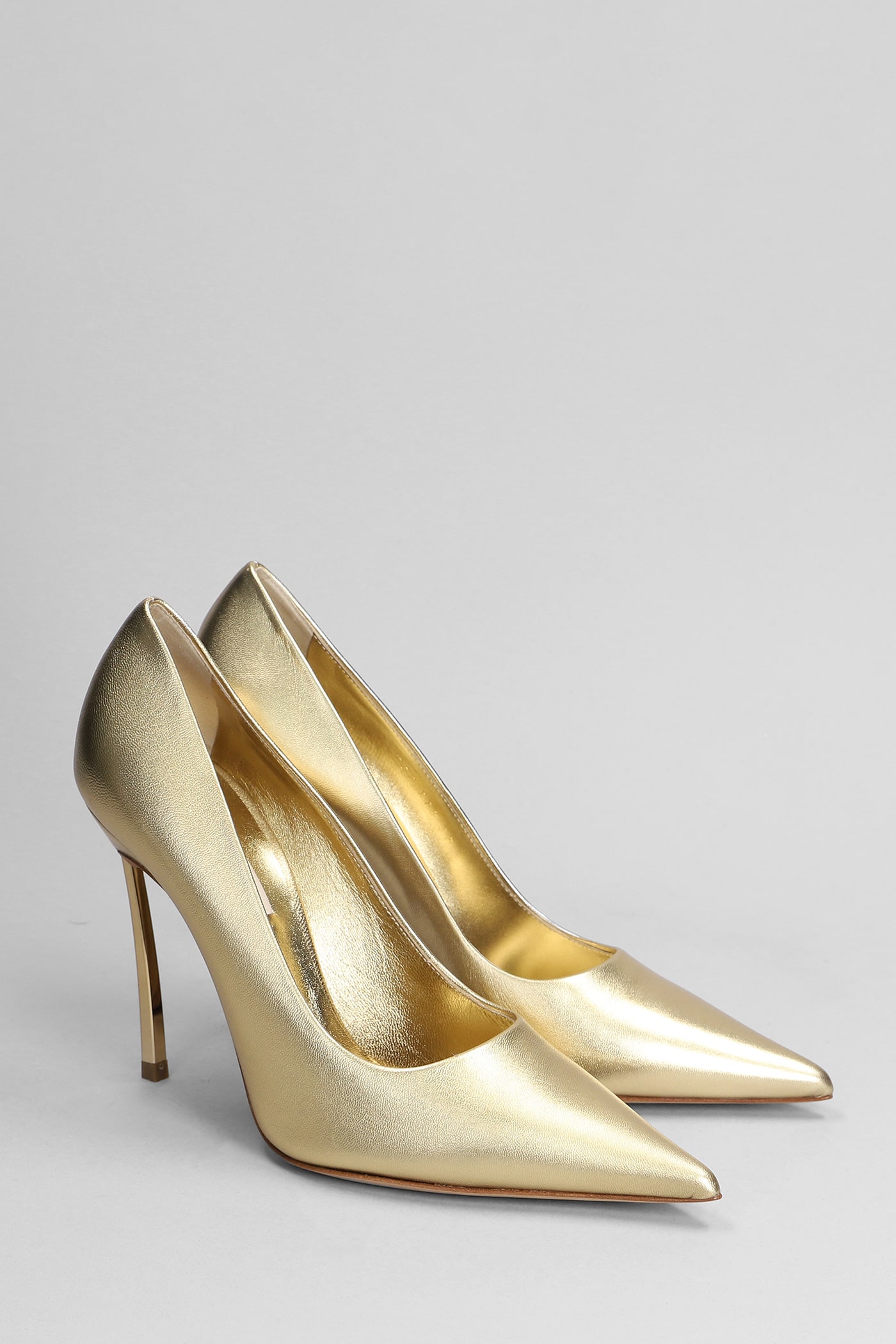 Shop Casadei Blade Flash Pumps In Gold Leather