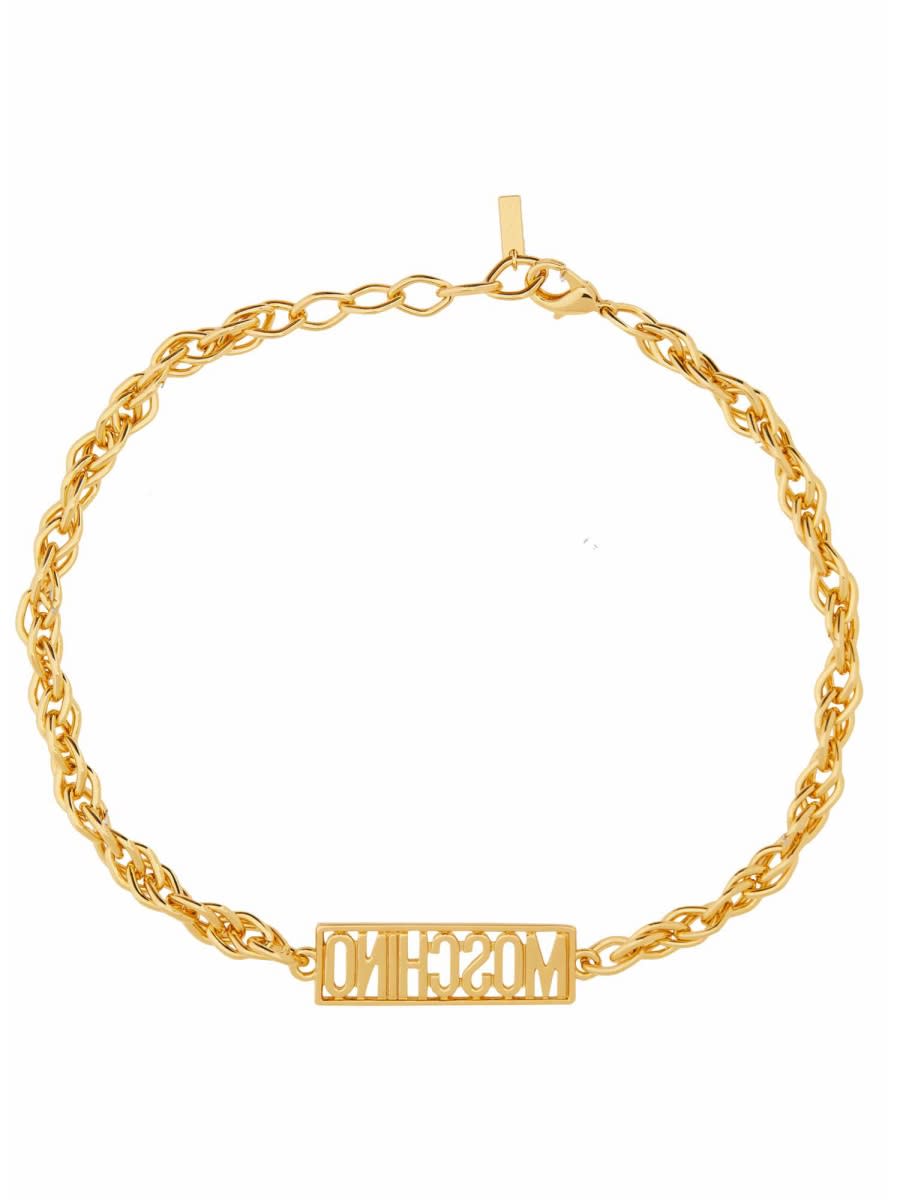 Shop Moschino Logo Bracelet In Gold