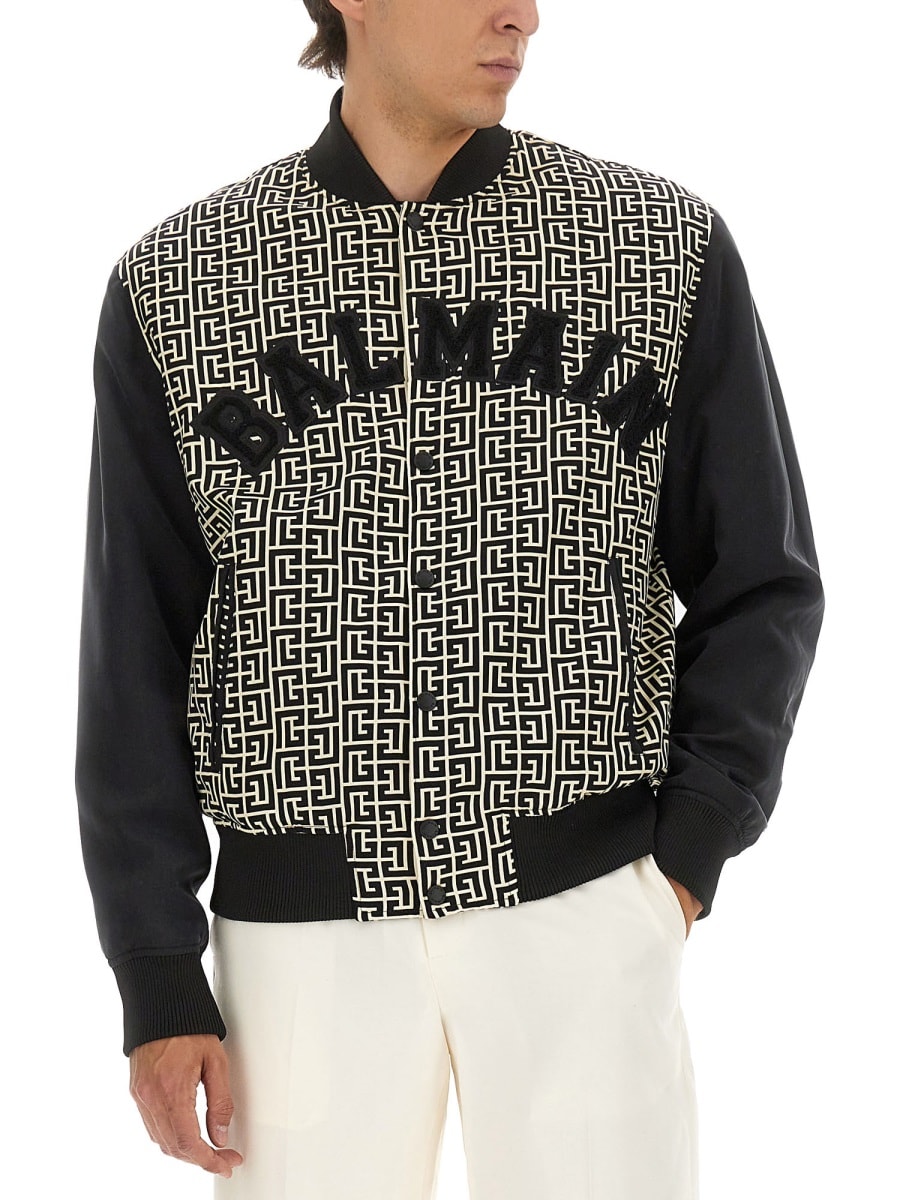 Balmain Monogrammed Varsity Jacket With Patches In Black