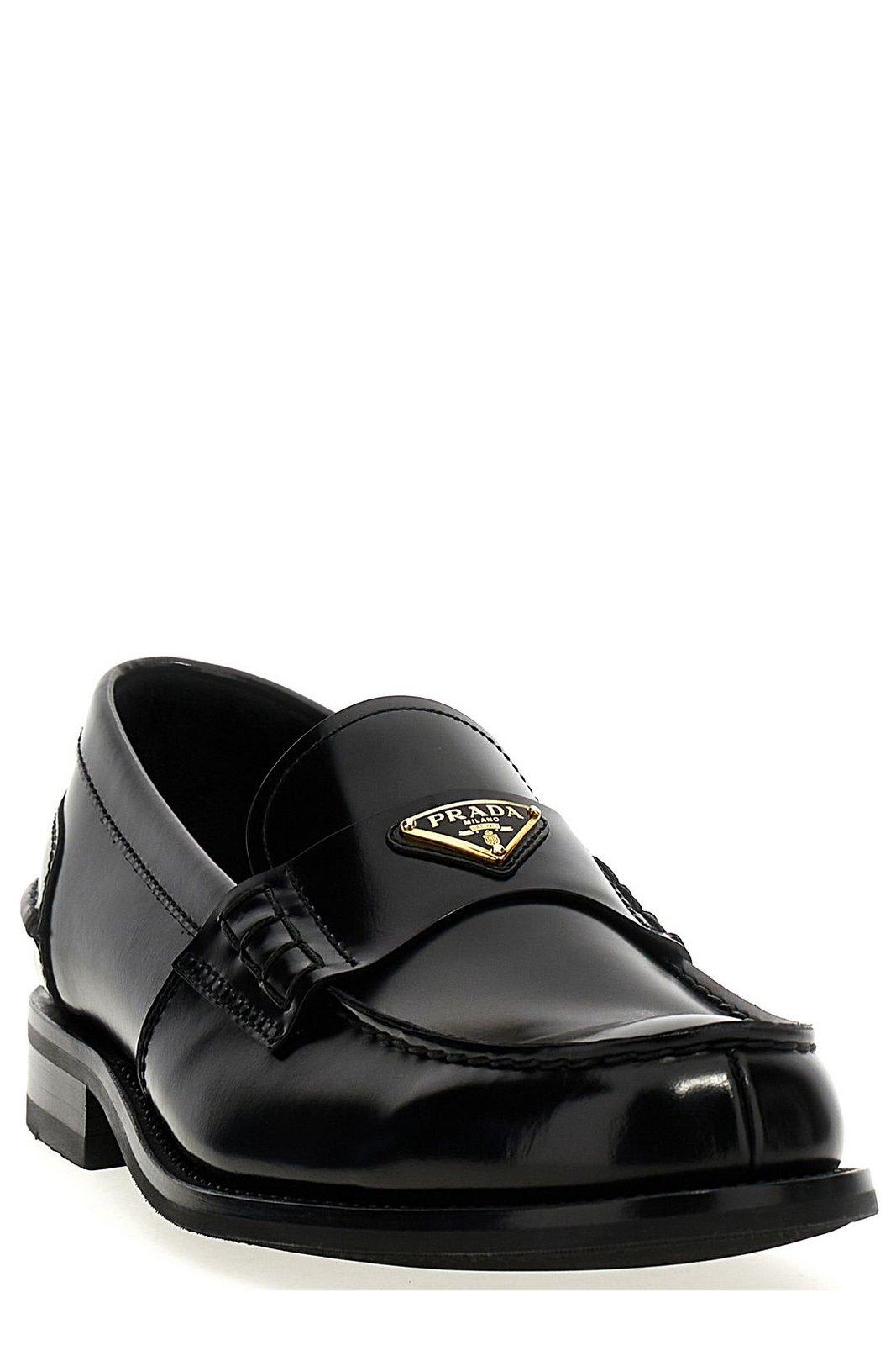 Prada Triangular Plaque Loafers In Black