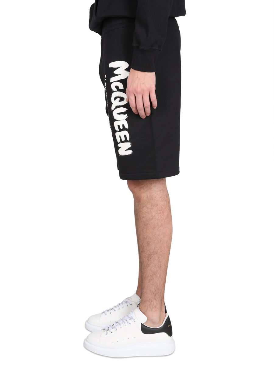 Shop Alexander Mcqueen Bermuda Shorts With Graffiti Logo Print In Black Ivory