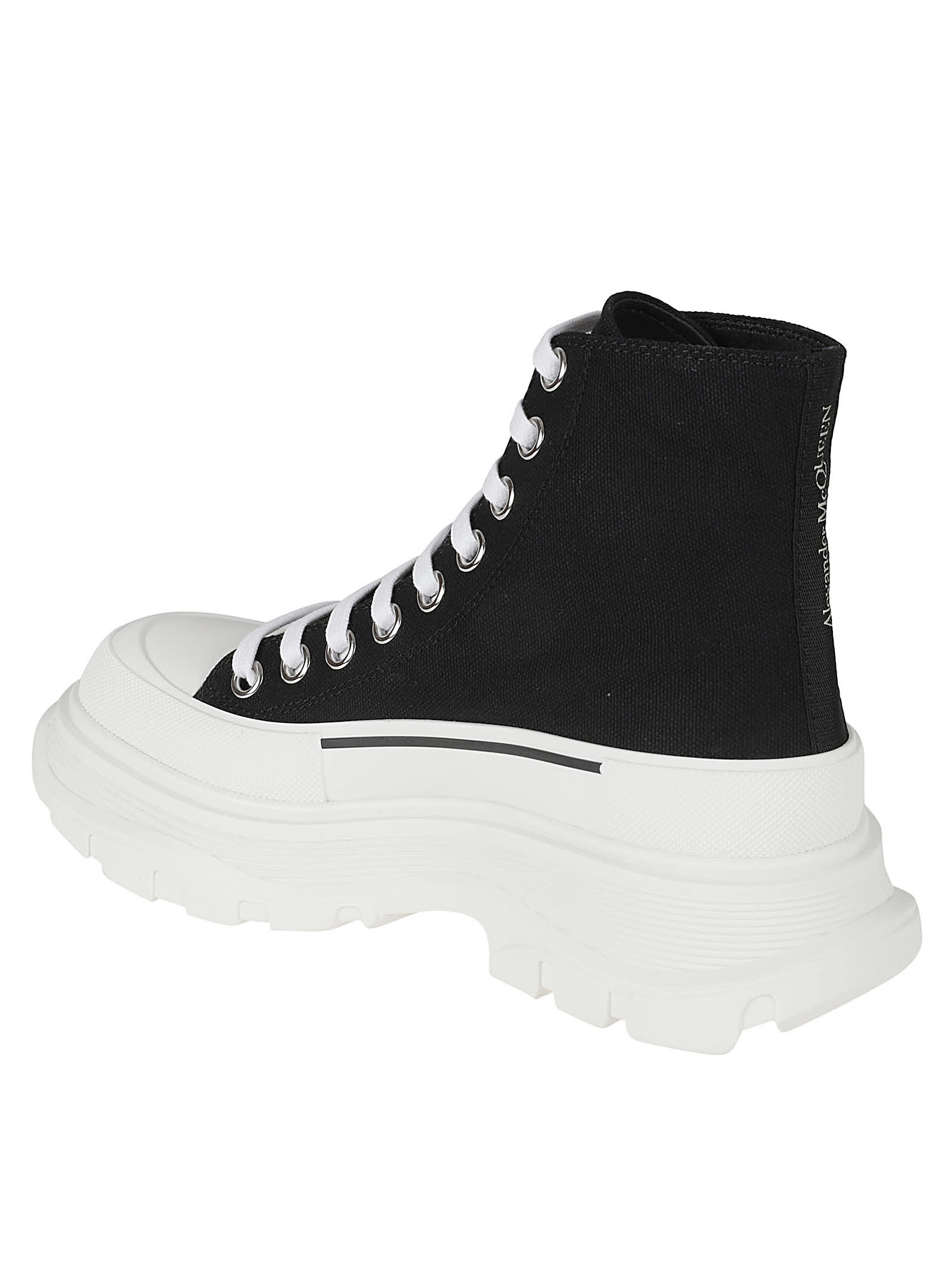 Shop Alexander Mcqueen Logo Embossed Lace-up Boots In Black/white