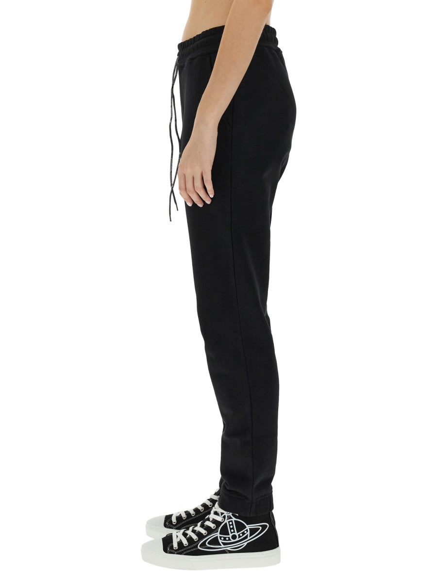 Shop Vivienne Westwood Jogging Pants With Spray Print Orb In Black