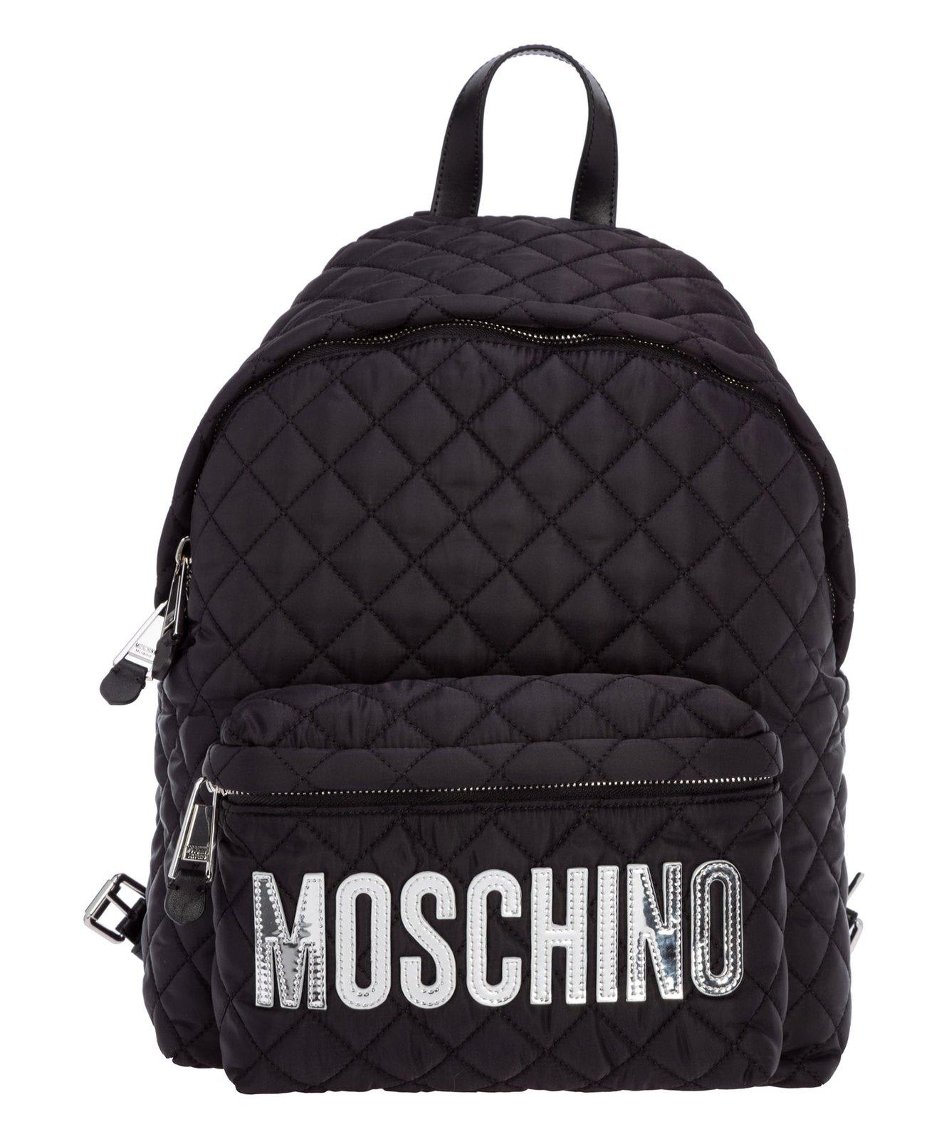 Shop Moschino Logo Patched Quilted Backpack In C