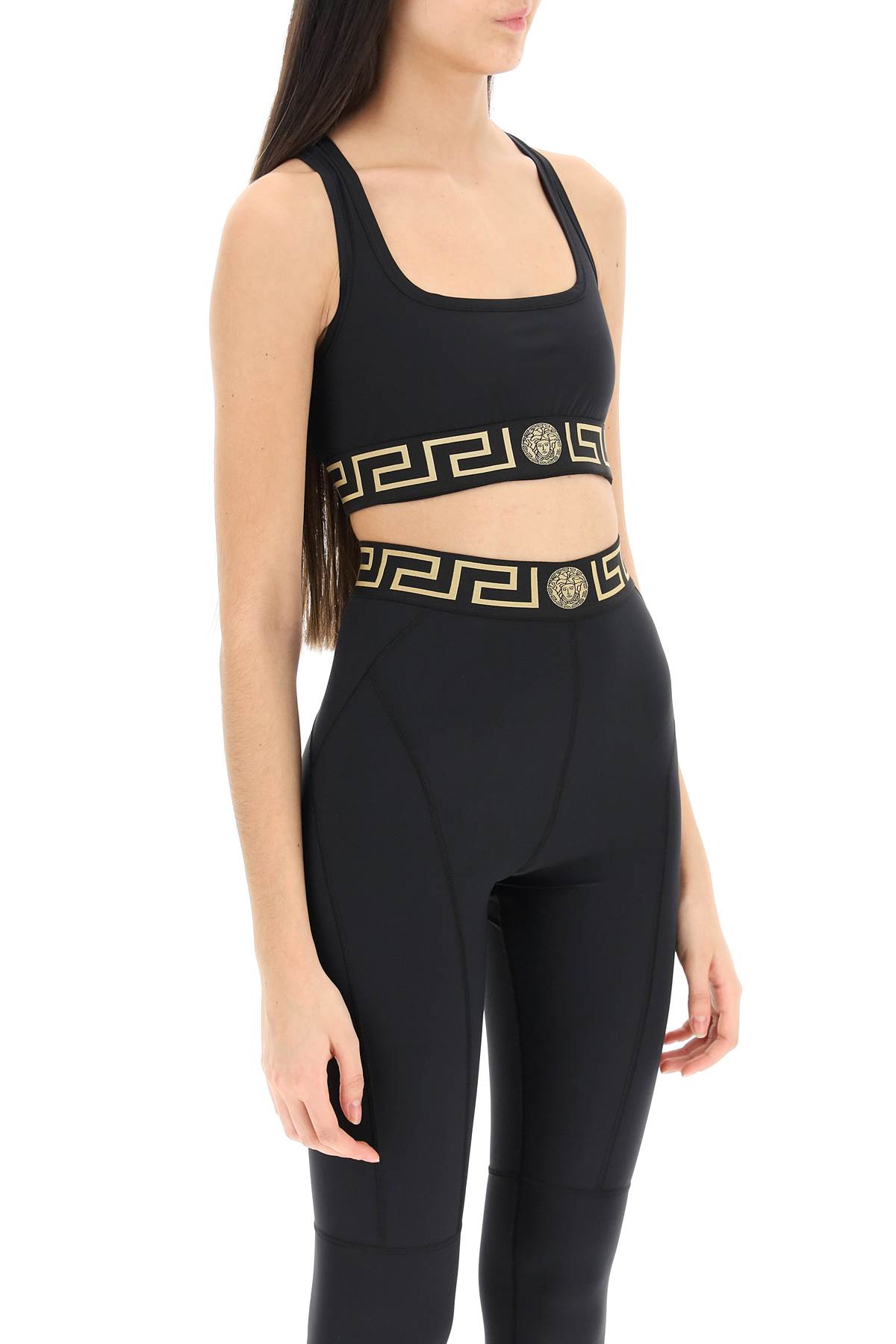 Shop Versace Sports Bra With Greca Band In Black