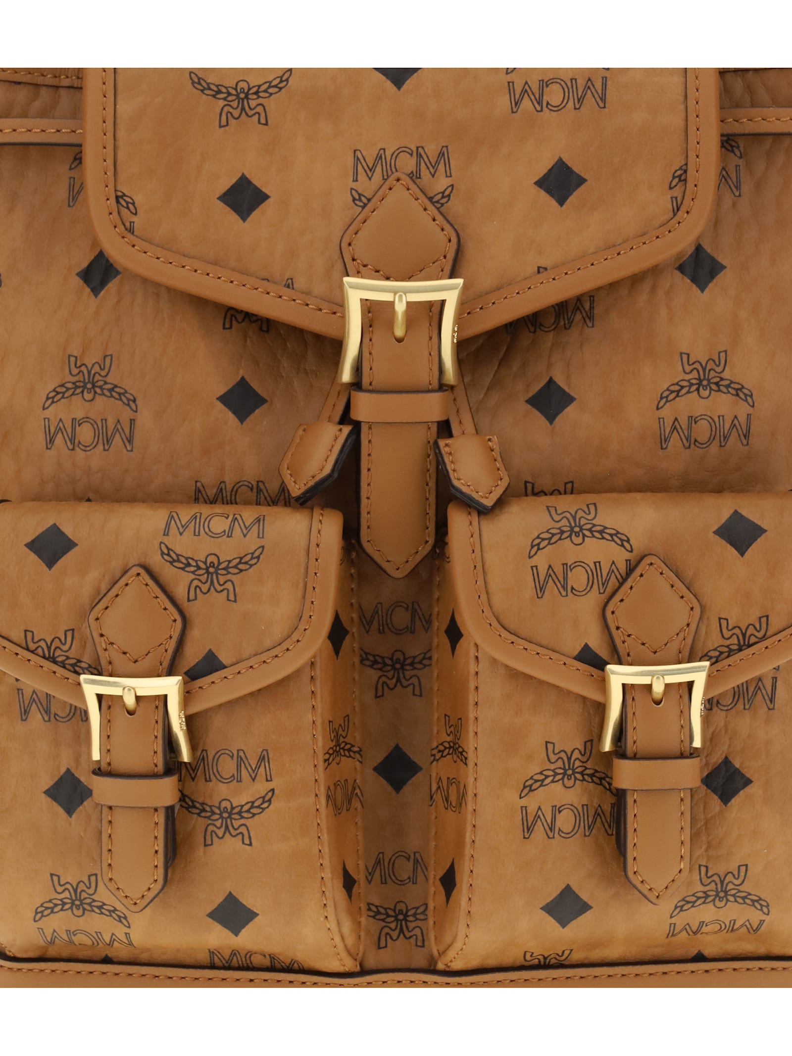 Mcm Monogram Buckle Backpack In Brown