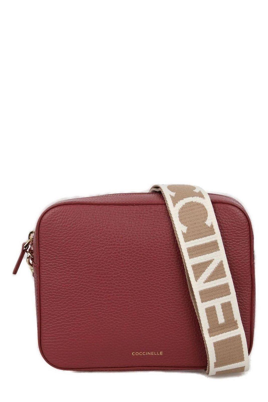 Shop Coccinelle Tebe Logo Printed Small Shoulder Bag In Brandy