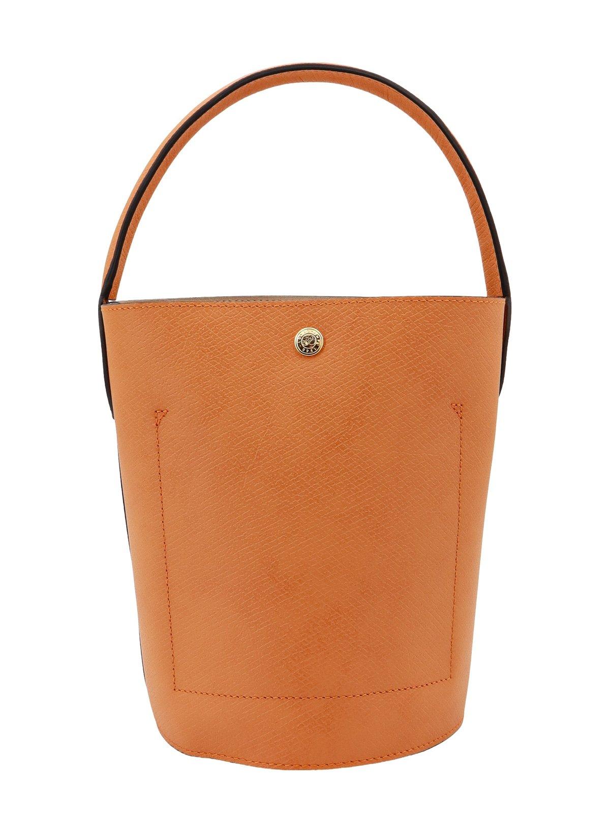 Shop Longchamp Re Logo Embossed Small Bucket Bag In Orange