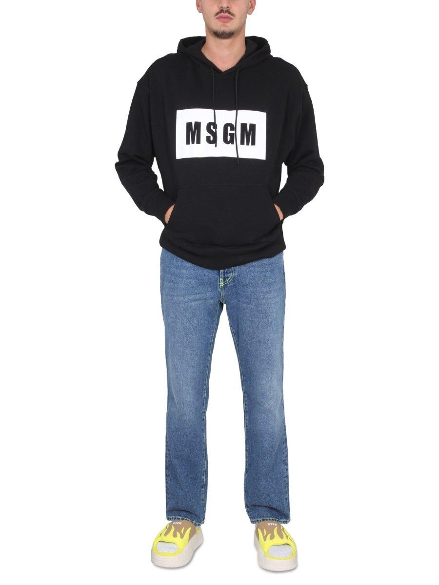 Shop Msgm Logo-printed Drawstring Hoodie In Black