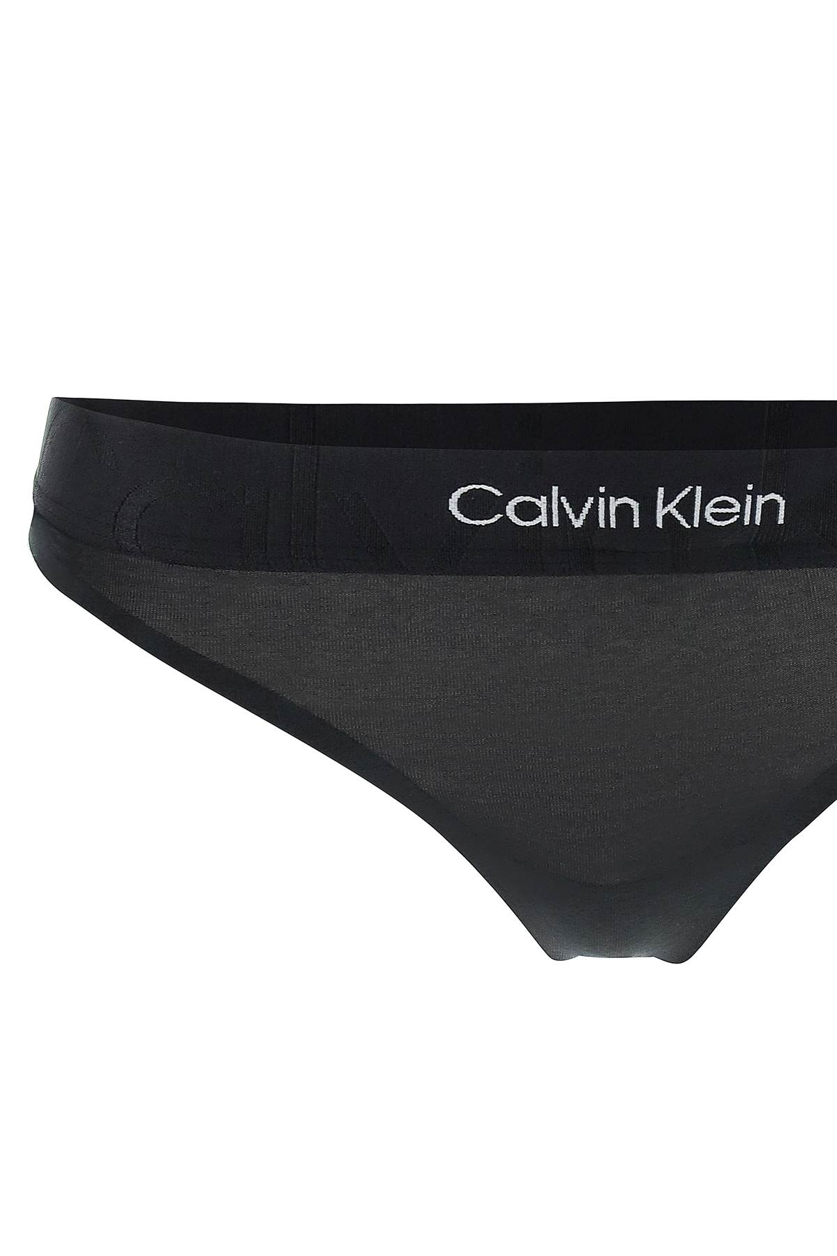 Shop Calvin Klein Embossed Icon Thong In Black (black)