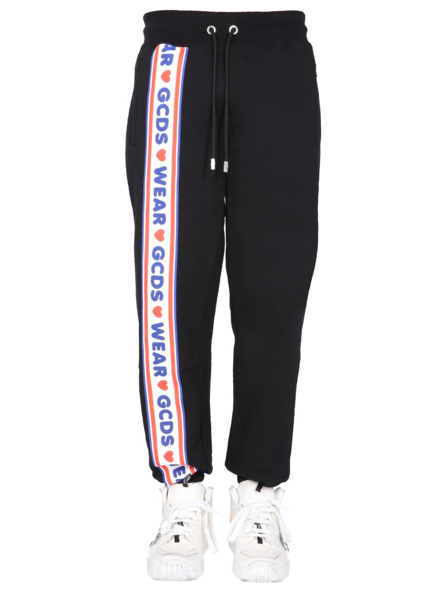 Shop Gcds Jogging Pants With Cute Tape Logo Band In Black