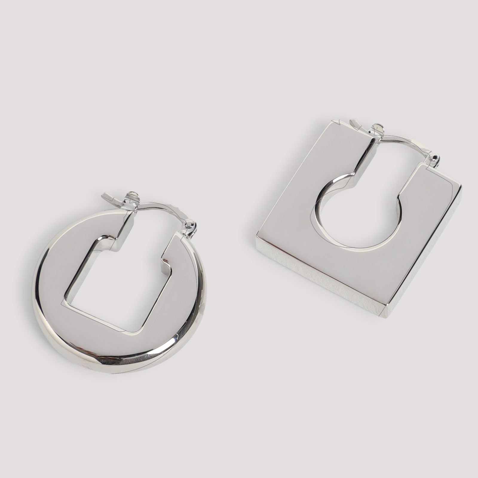 Jacquemus Asymmetric Geometric Earrings In Polished Plated Brass In Metallic