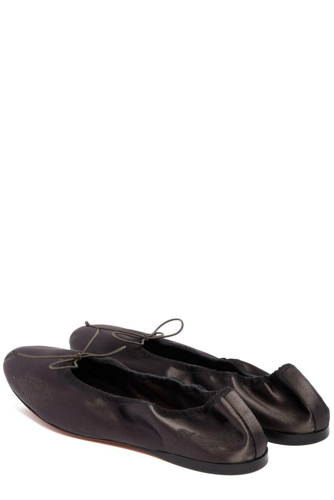 The Row Bow Detailed Slip-on Flat Shoes In Charcoal