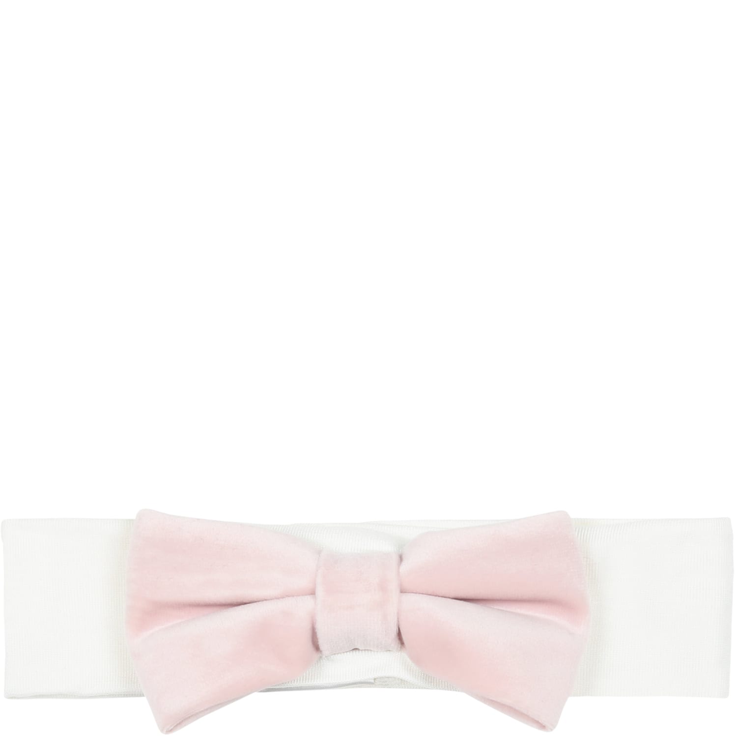 La stupenderia White Headband Decorated With Pink Velvet Bow On The Front.