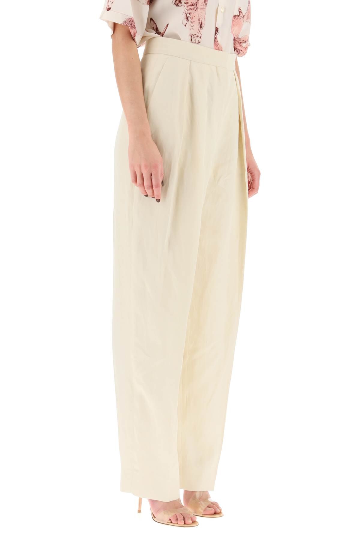 Shop Stella Mccartney Loose Linen Blend Pants With Front Pleats In Buttermilk (beige)