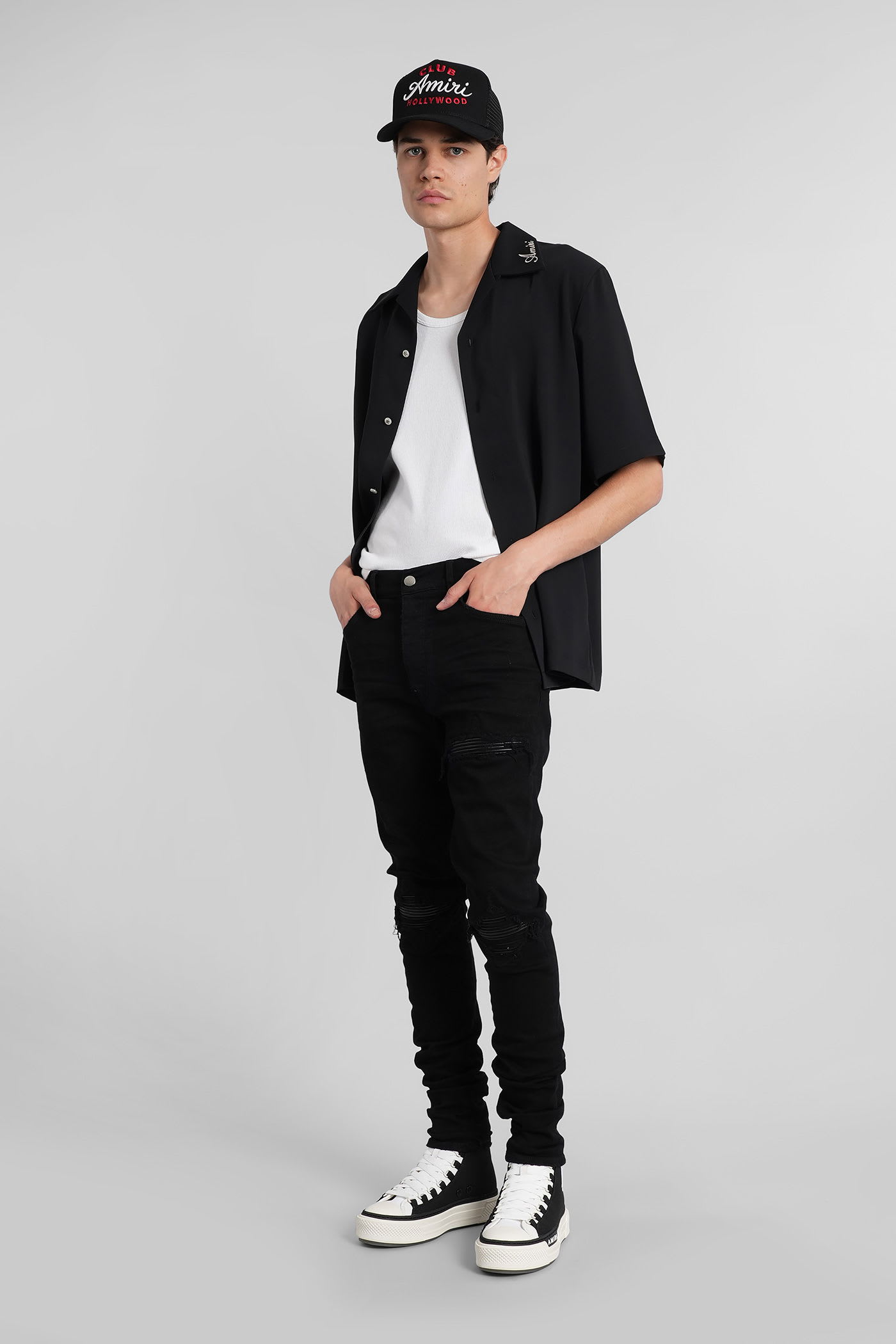 Amiri Slim Fit Distressed Five-pocket Trousers In Black