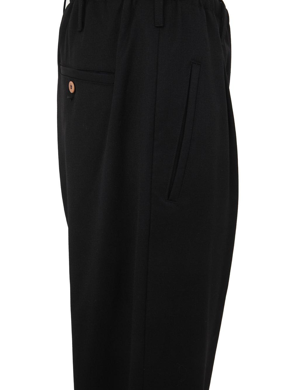 Shop Magliano Low-rise Wide-leg Trousers In Black