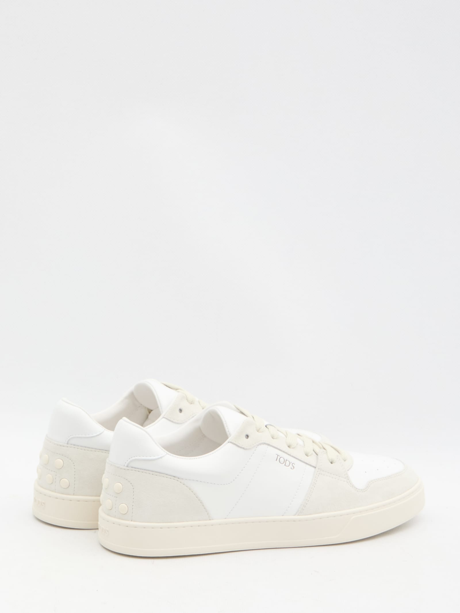 Shop Tod's Leather Sneakers In White