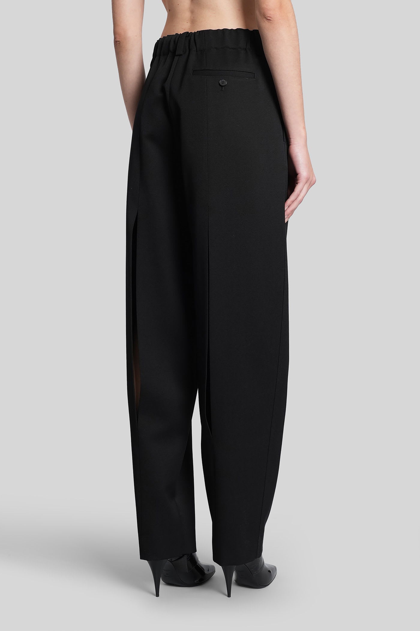 Givenchy Slashed Double-pleated Tapered-leg Trousers In Black