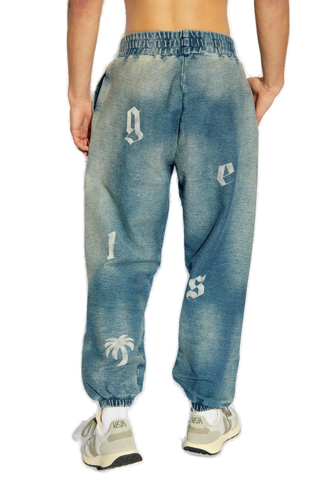 Shop Palm Angels Letter Printed Elastic Waistband Jeans In Blu