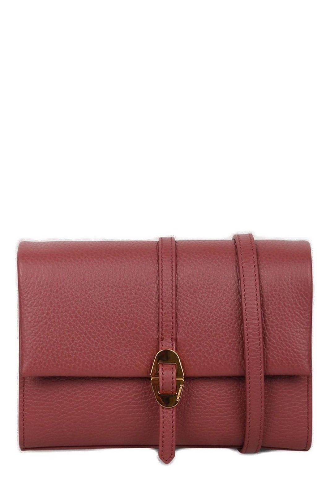 Shop Coccinelle Dorian Logo Stamp Crossbody Bag In Brandy