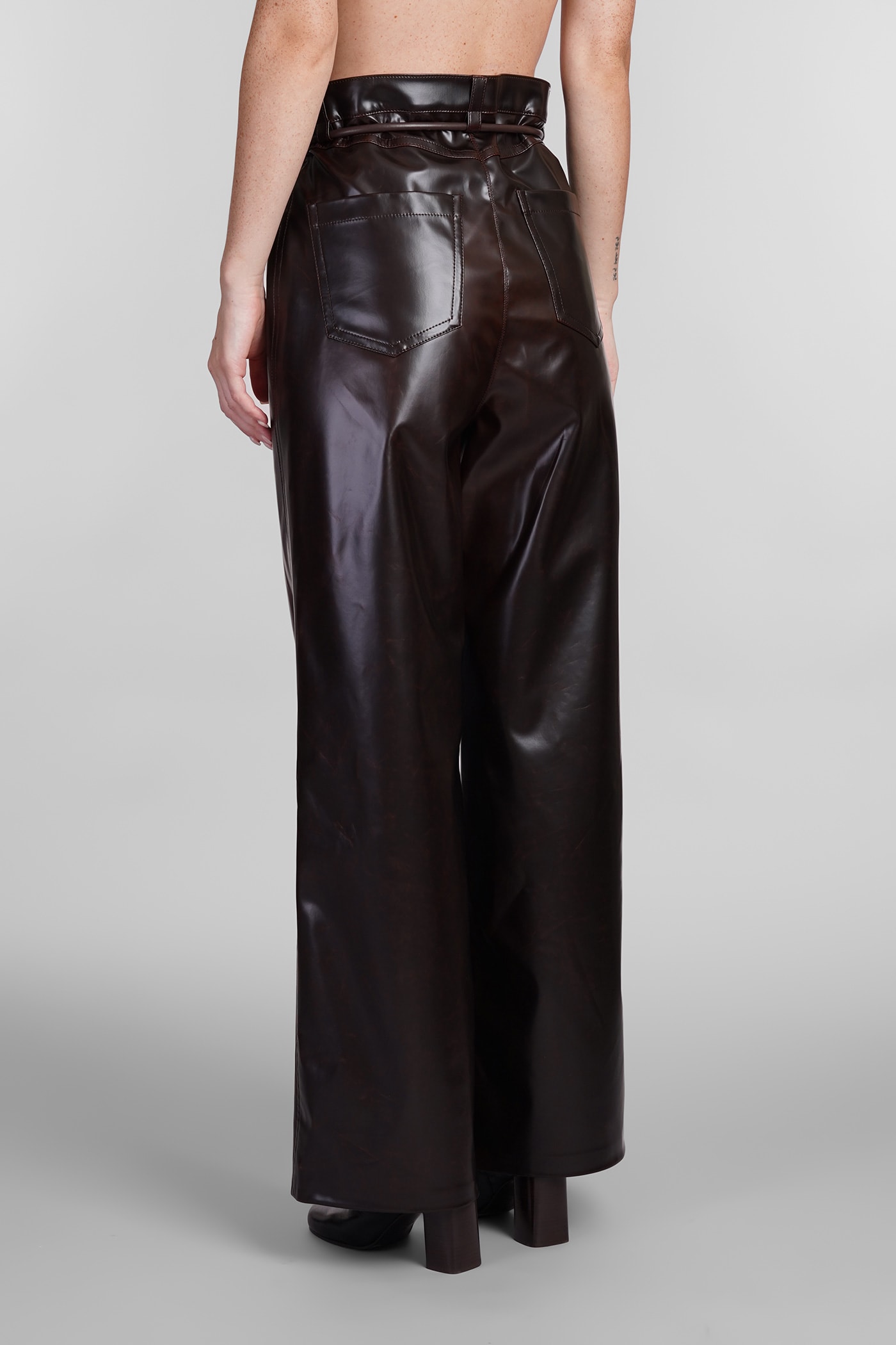 Shop Nanushka Pants In Brown Polyuretan