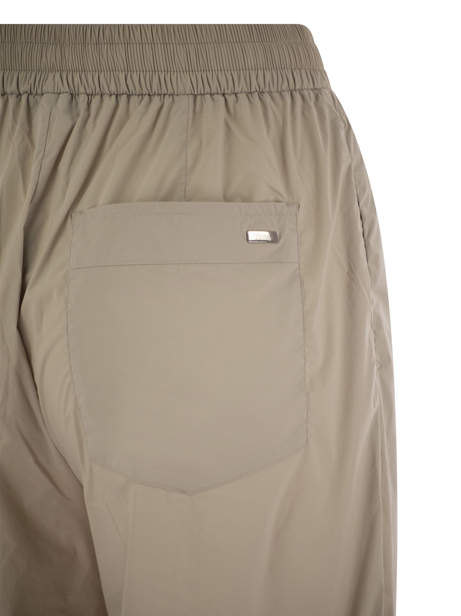 Shop Herno Stretch Nylon Trousers In Beige