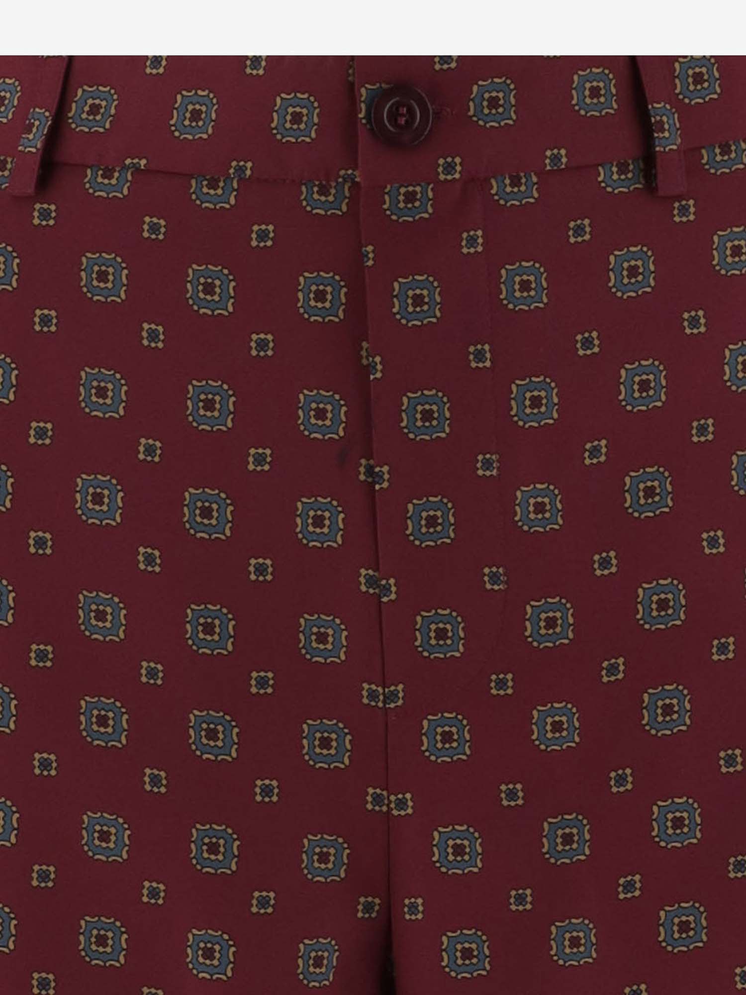 Shop Moschino Patterned Pants In Red