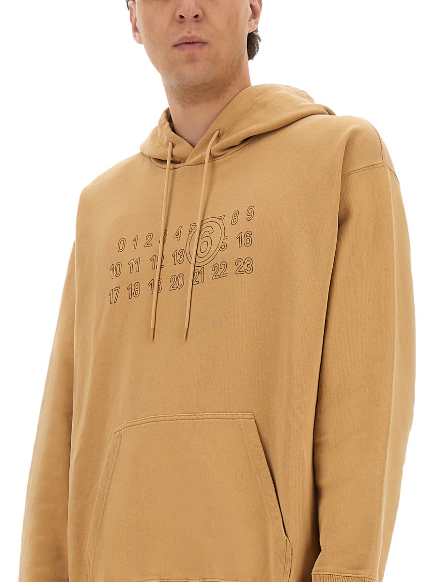 Mm6 Maison Margiela Mm6 By Maison Margiela Relaxed-fit Cotton Hoodie With Unique Graphic Print In Brown