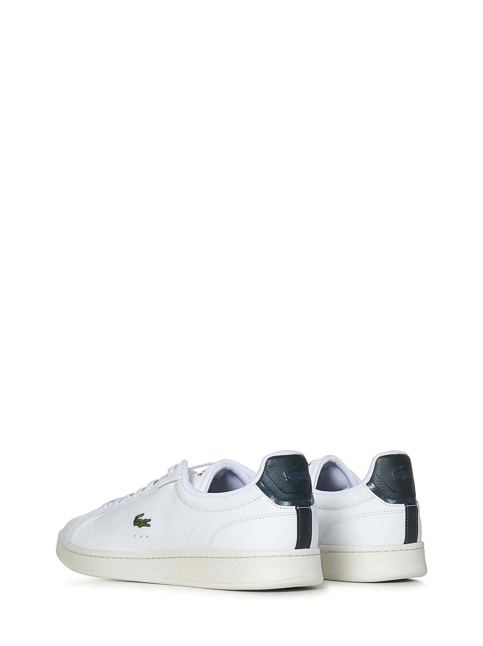 Shop Lacoste Carnaby Pro Sneakers In White