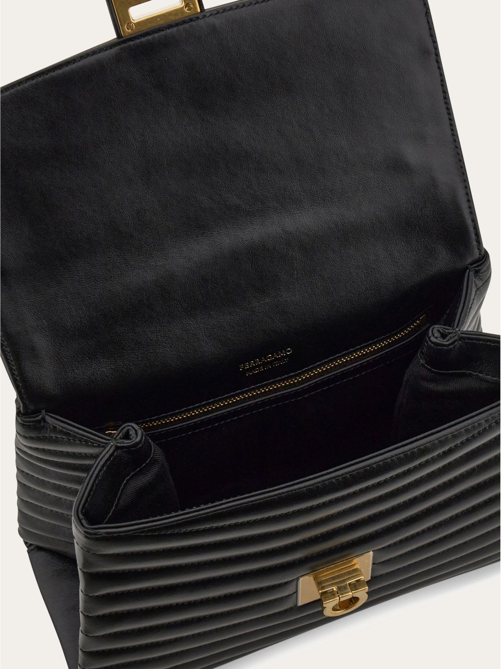 Shop Ferragamo Black Quilted Handbag (m)