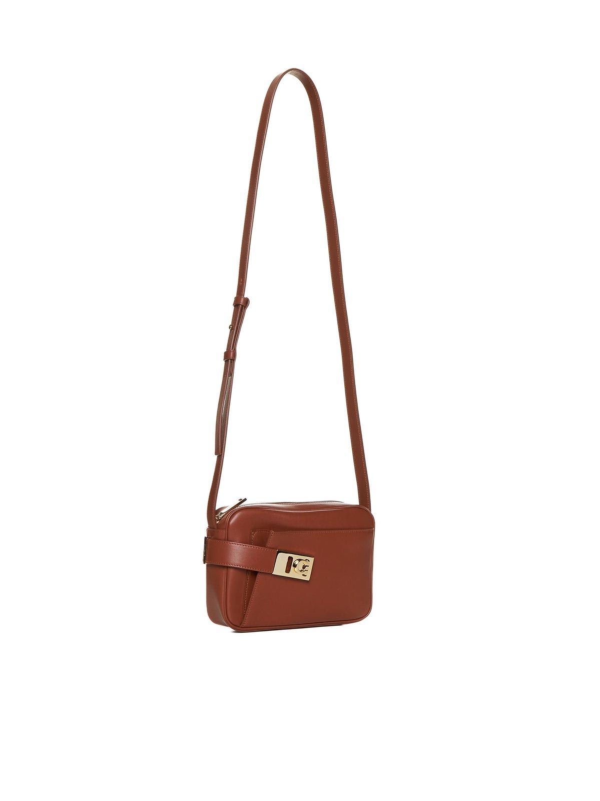 Shop Ferragamo Small Camera Case Logo Engraved Crossbody Bag In Brown