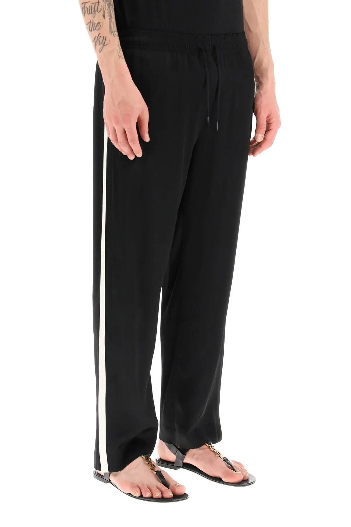 Shop Saint Laurent Crêpe Satin Jogger Pants In Black