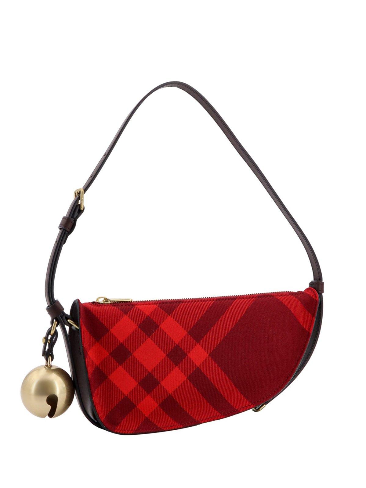 Shop Burberry Mini Shield Check-pattern Bell-charm Shoulder Bag In Red