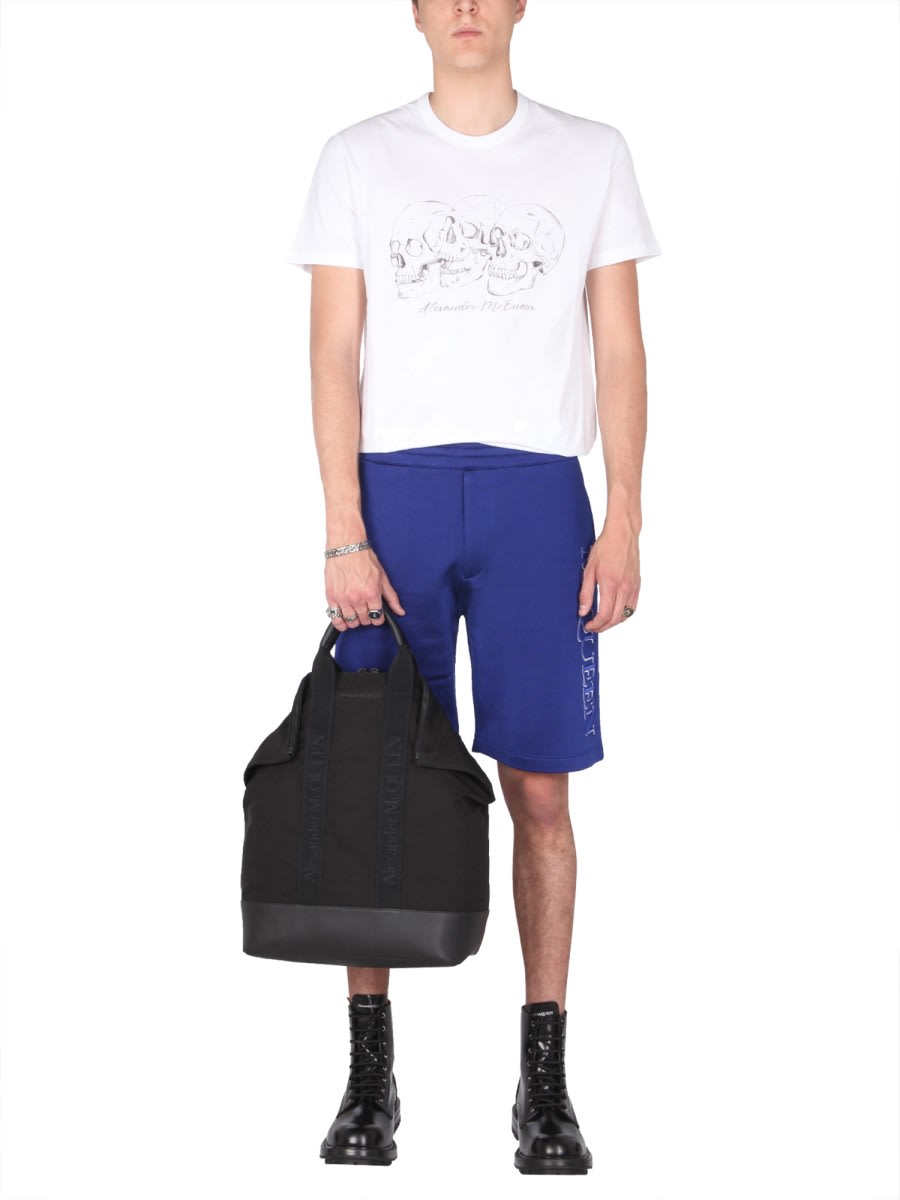 Shop Alexander Mcqueen Shorts With Embroidered Logo In Blue