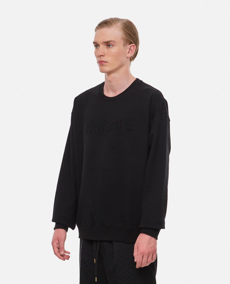 Shop Versace Crewneck Embossed Logo Sweatshirt In Black
