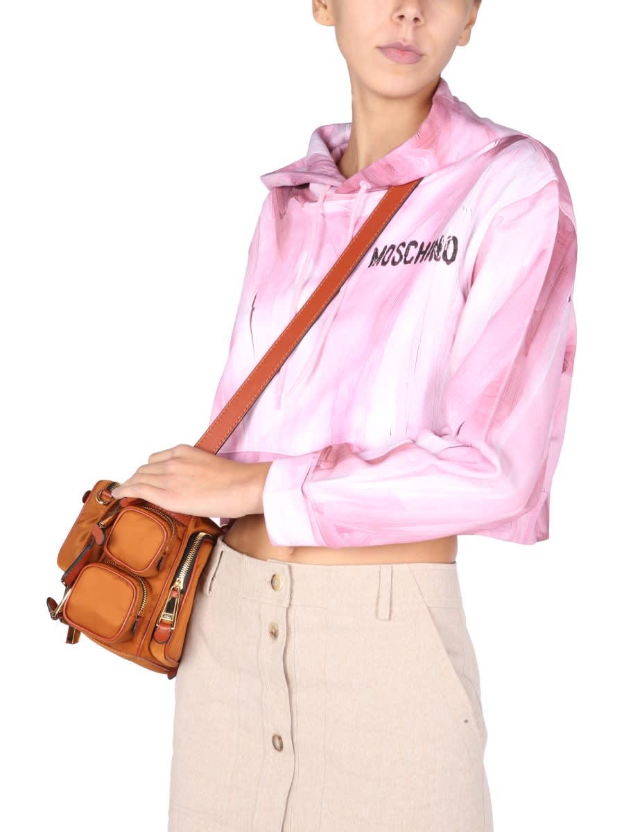 Shop Moschino Art Theme Cropped Sweatshirt In Pink