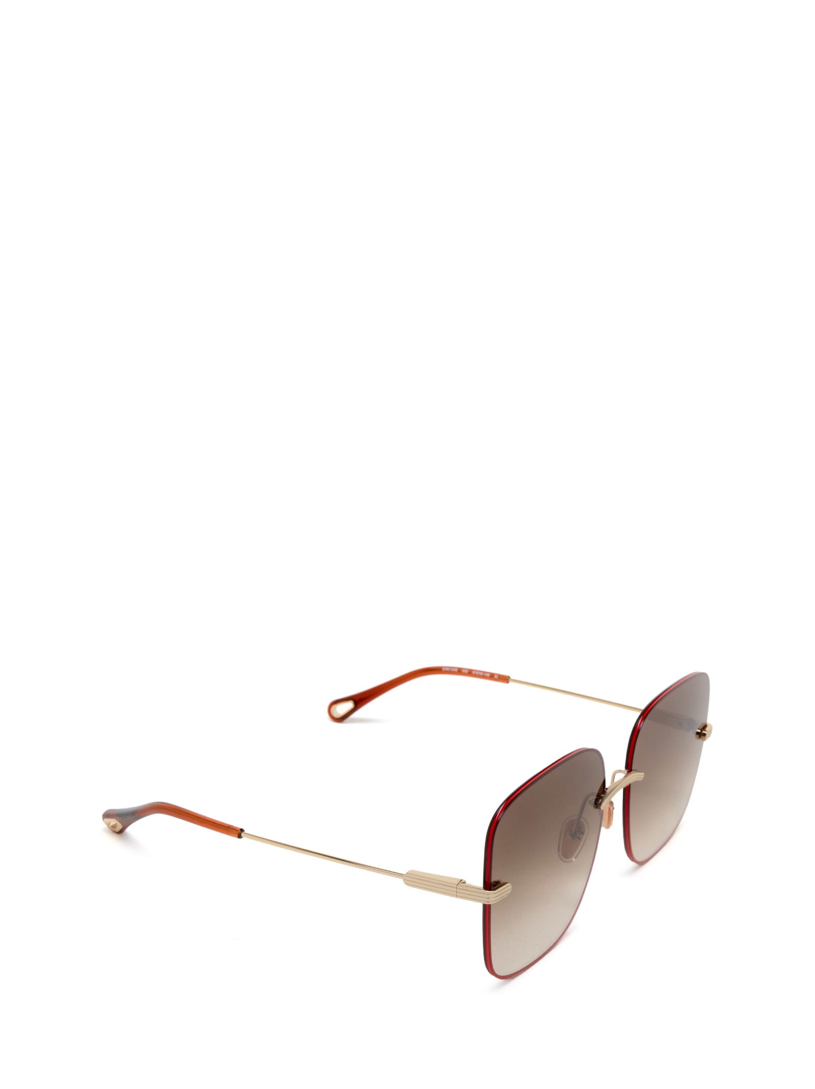 Shop Chloé Ch0134s Gold Sunglasses