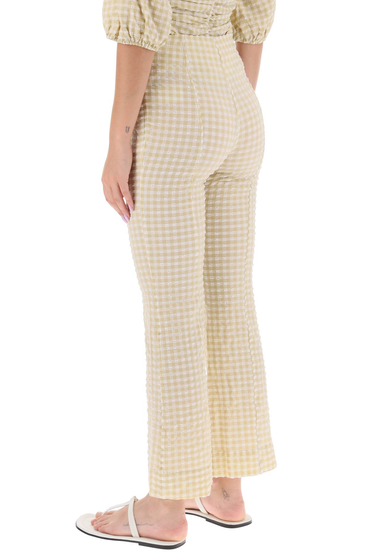 Shop Ganni Flared Pants With Gingham Motif In Pale Khaki (beige)
