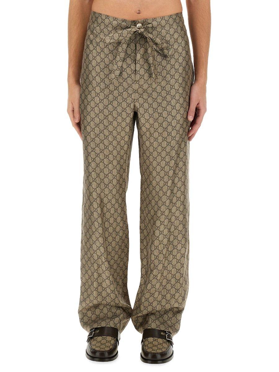 Shop Gucci Gg Supreme Printed Pants In Beige