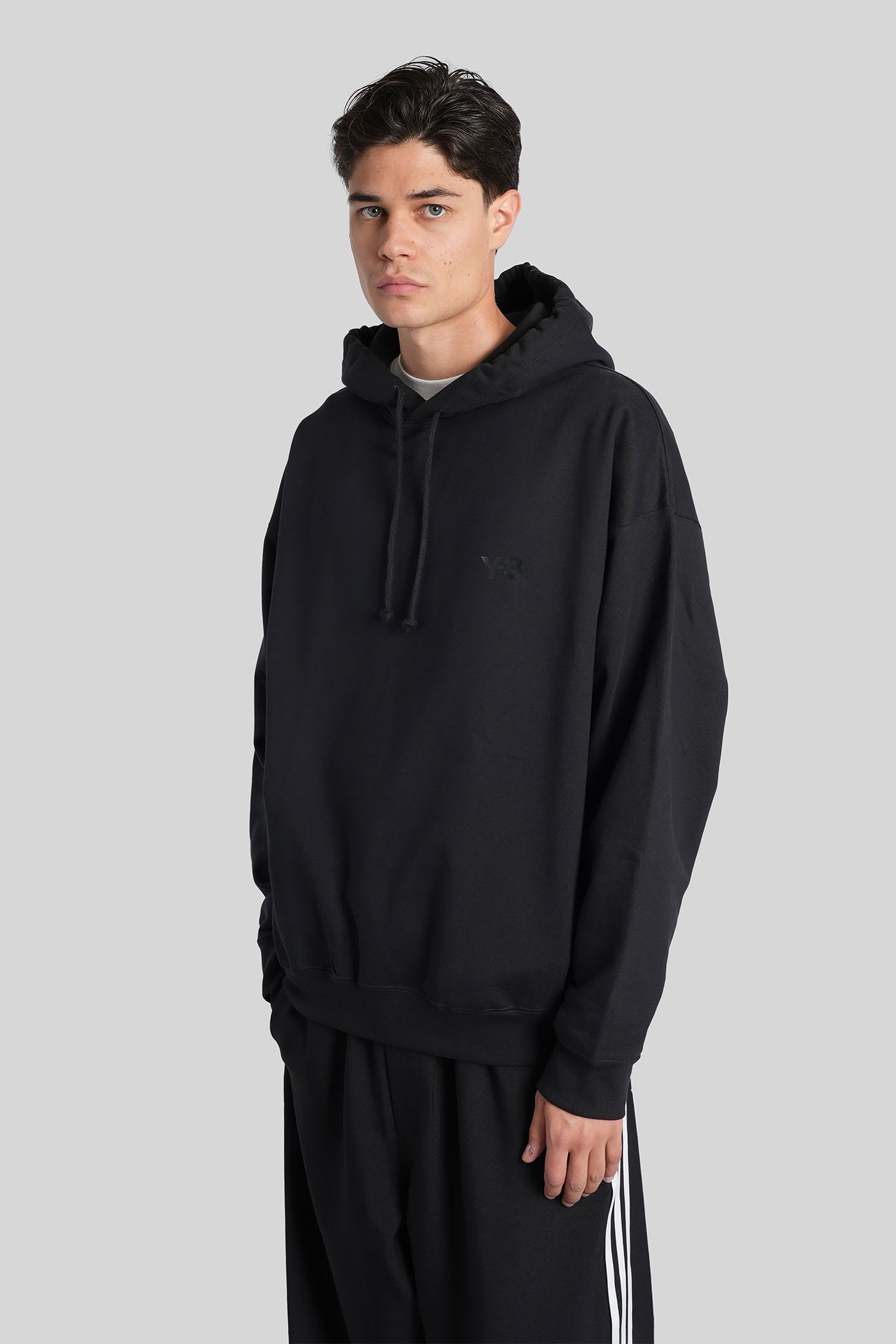Y-3 Relaxed-fit Black Hoodie With Subtle Front Logo And Side Pockets In Black