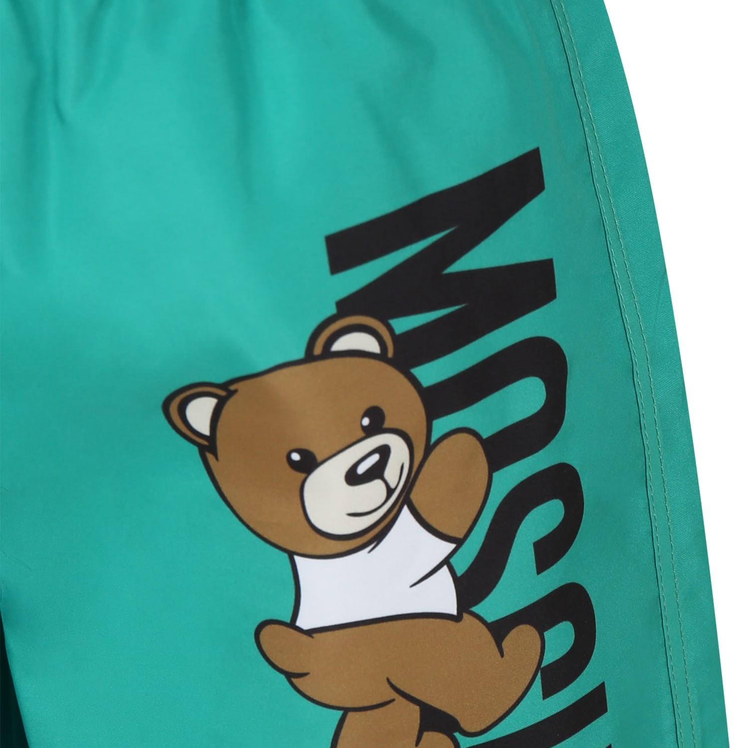 Shop Moschino Green Swim Shorts For Boy With Teddy Bear And Logo