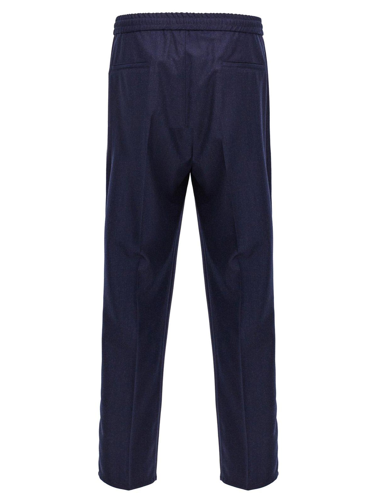 Shop Brunello Cucinelli Pleated Tapered Leg Trousers In Blue