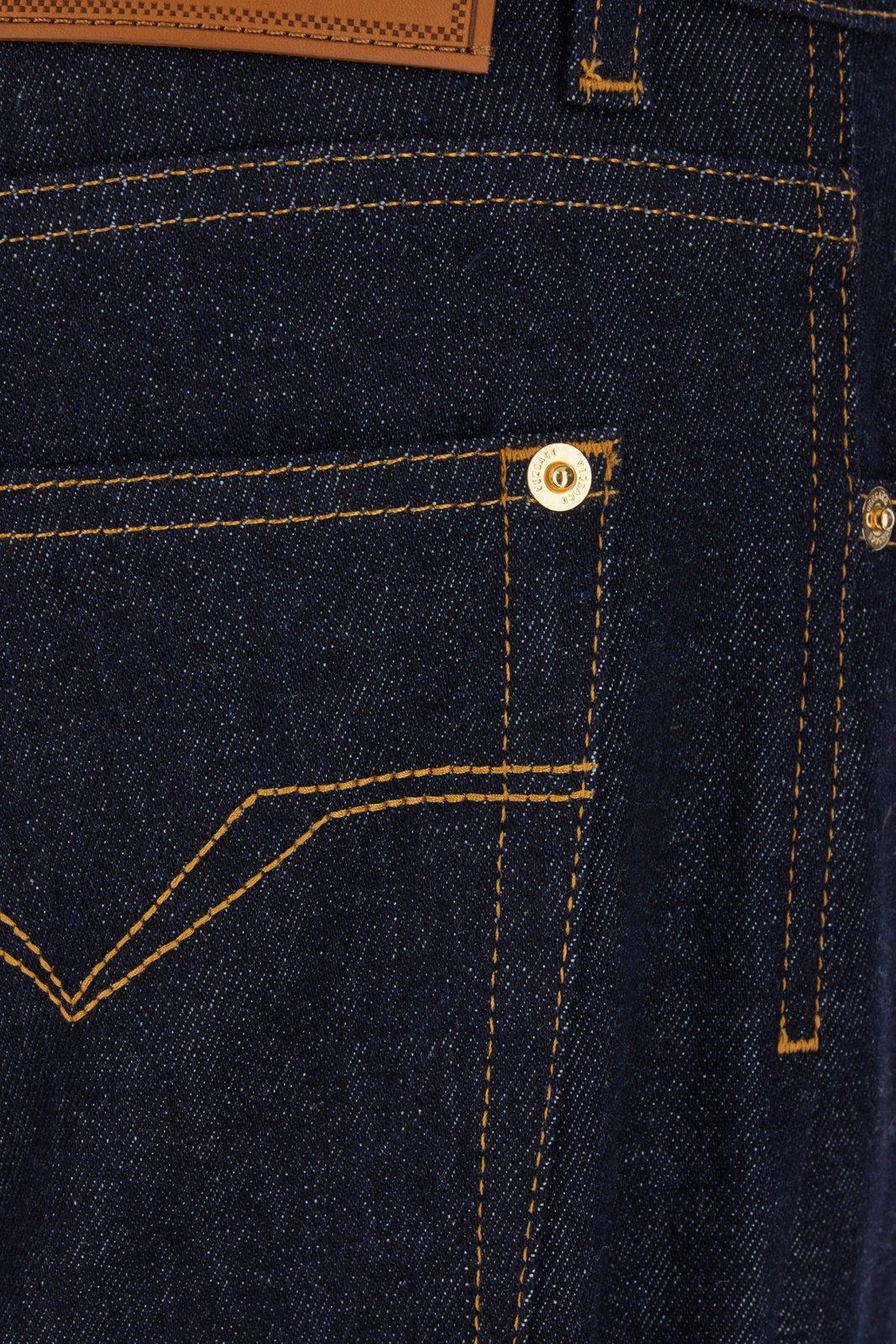 Shop Versace Logo Patch Straight-leg Jeans In Denim