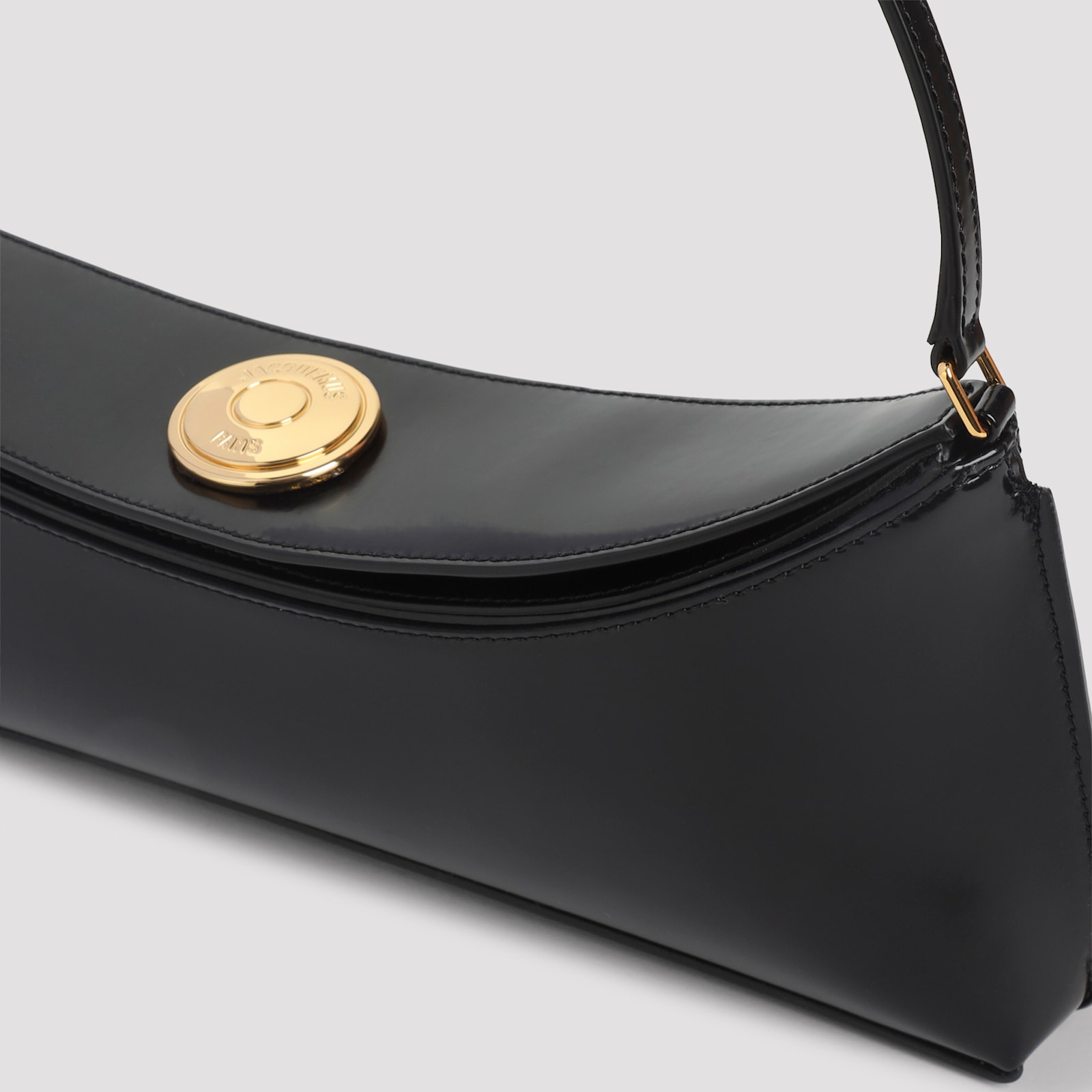 Jacquemus Curved Gold Handle Shoulder Bag In Black