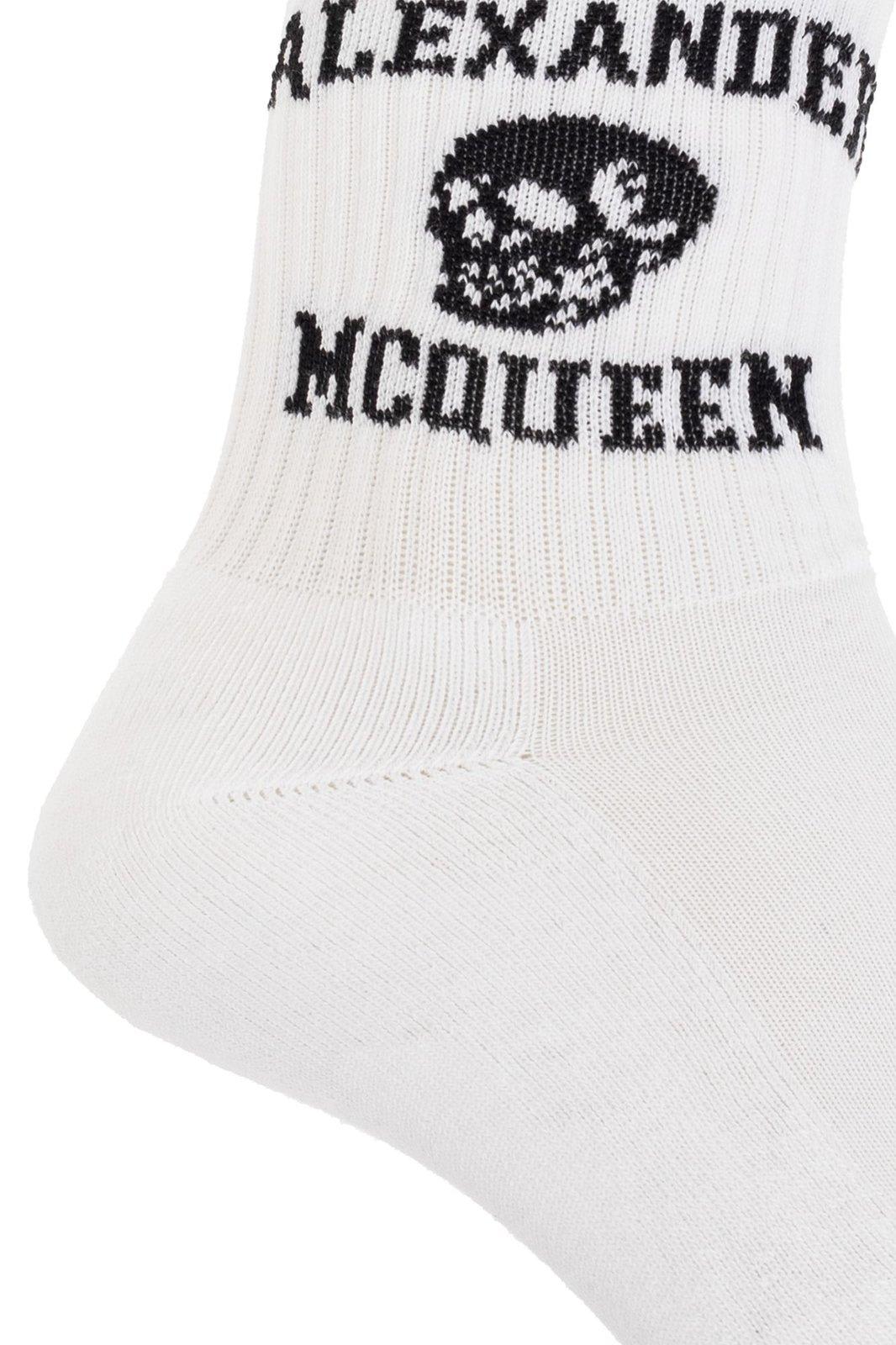 Shop Alexander Mcqueen Logo Skull Intarsia Knitted Socks In White/black